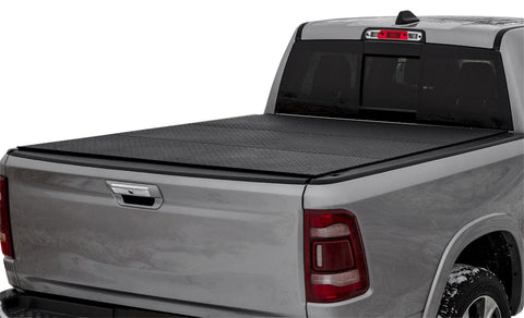 LOMAX Hard Tri-Fold tonneau cover: silver pickup on white, tri-fold closed, black diamond-plate urethane