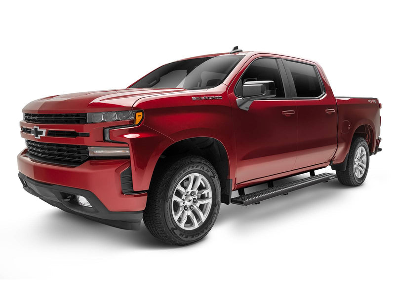 Front three-quarter view of a red Chevrolet Silverado 1500 crew cab fitted with N-Fab Growler Fleet grip-plate side steps