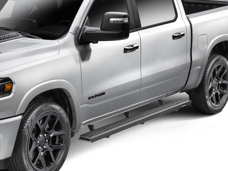 N-Fab Growler Fleet side steps in textured black, front three-quarter view, installed along the rocker, on a Ram 1500