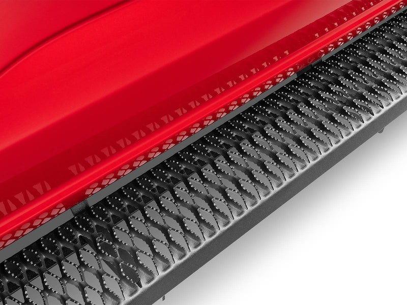 Close-up of the textured black Growler Fleet grip-plate tread along a red rocker