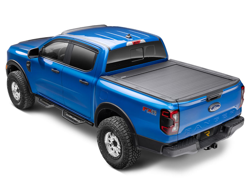 N-Fab Nerf Step RS step bars in textured black, rear three-quarter view, shown with accessories (not included)
