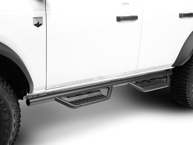 N-Fab Nerf Step RS step bars in textured black, side profile, installed along the rocker, on a Ford Bronco