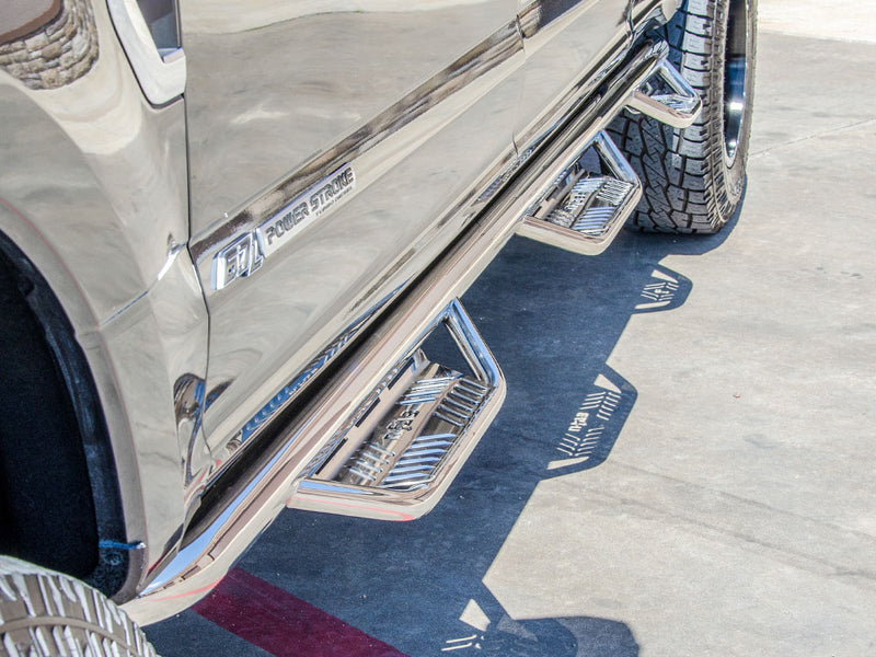 N-Fab Podium bed access nerf step bars in polished stainless, close view, installed along the rocker