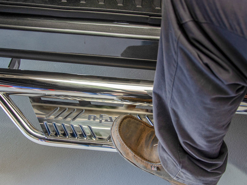 N-Fab Podium bed access nerf step bars in polished stainless, foot on the step