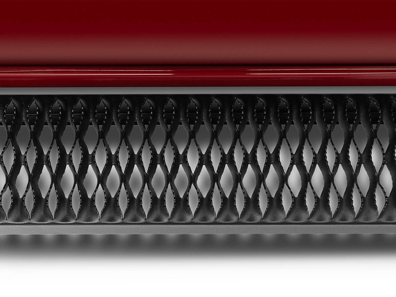 Straight-on close-up of the Growler Fleet grip-plate tread below a red rocker