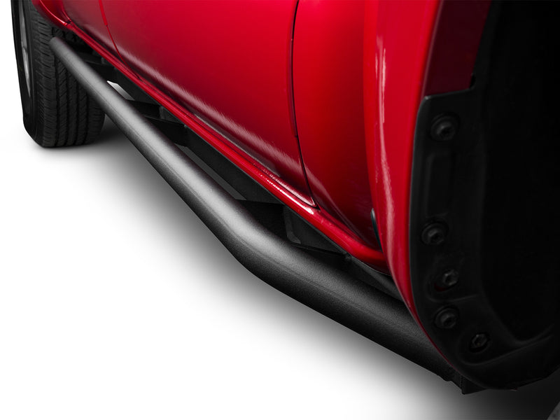 N-Fab TrailSlider step system in textured black, low view, installed along the rocker, on a Toyota Tacoma