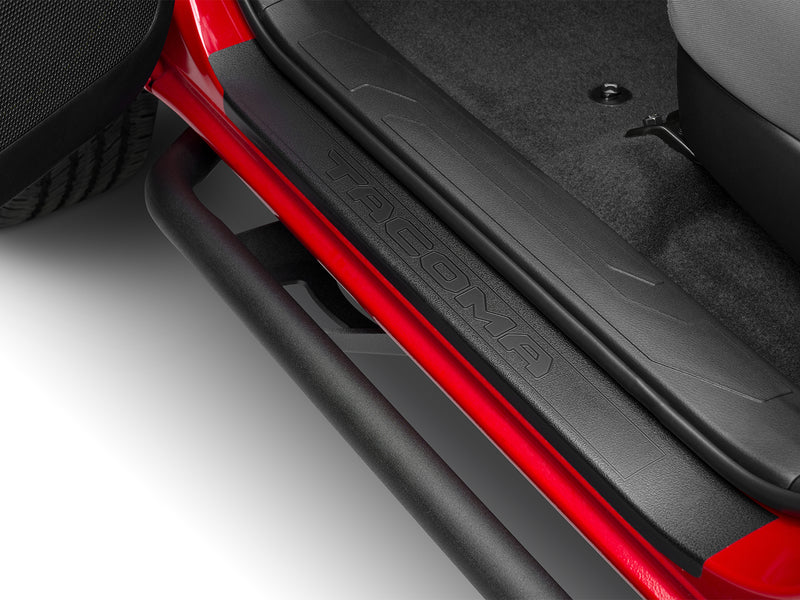 N-Fab TrailSlider step system in textured black, installed along the rocker below an open door, on a Toyota Tacoma