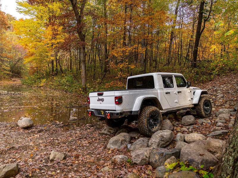 N-Fab TrailSlider step system in textured black, installed, vehicle seen, shown with a rear bumper (not included)