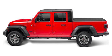 Red 2020 Jeep Gladiator fitted with a TruXedo Sentry CT hard roll-up cover