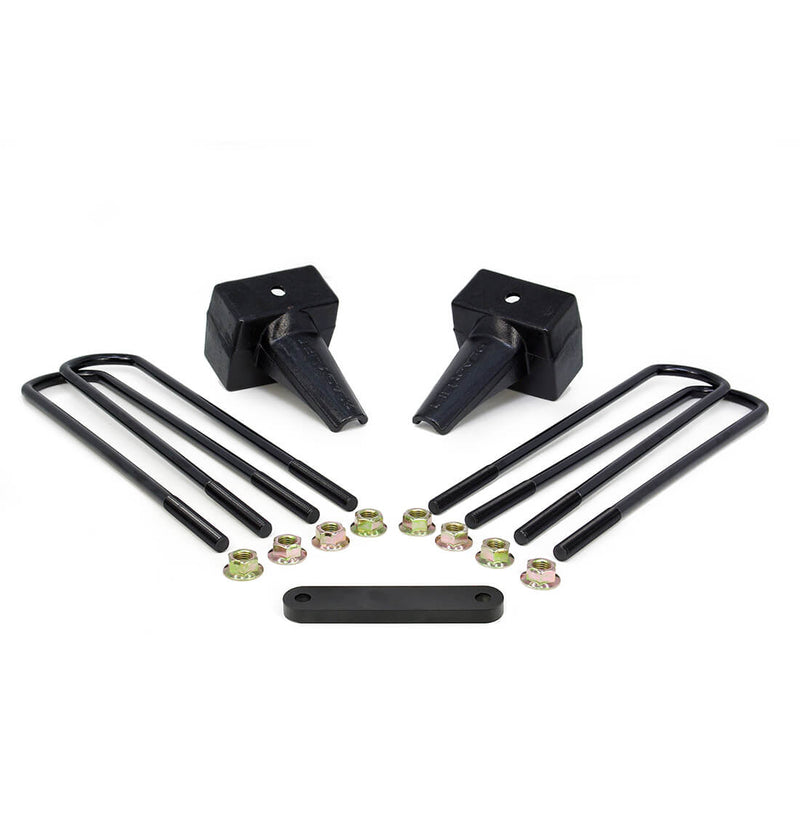 ReadyLIFT Block Kit, full kit on a studio background: two black tapered rear lift blocks with square black U-bolts, gold nuts and a flat spacer plate on white