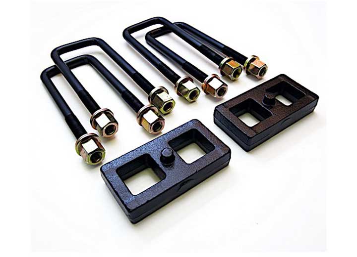 ReadyLIFT Block Kit, full kit on a studio background: two flat black cast 1" rear lift blocks with four square U-bolts and gold nuts on white