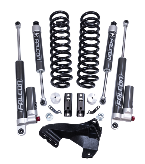 ReadyLIFT Coil Spring Front Lift Kit, full kit on a studio background: coil springs, track bar bracket, two Falcon 2.1 shocks, two Falcon reservoir shocks and spacers on a black background