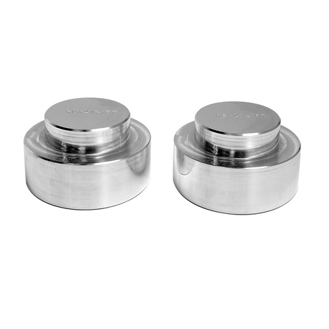 ReadyLIFT Coil Spring Spacer, full kit on a studio background: two machined aluminum rear coil spring spacers with faint ReadyLIFT etching on white