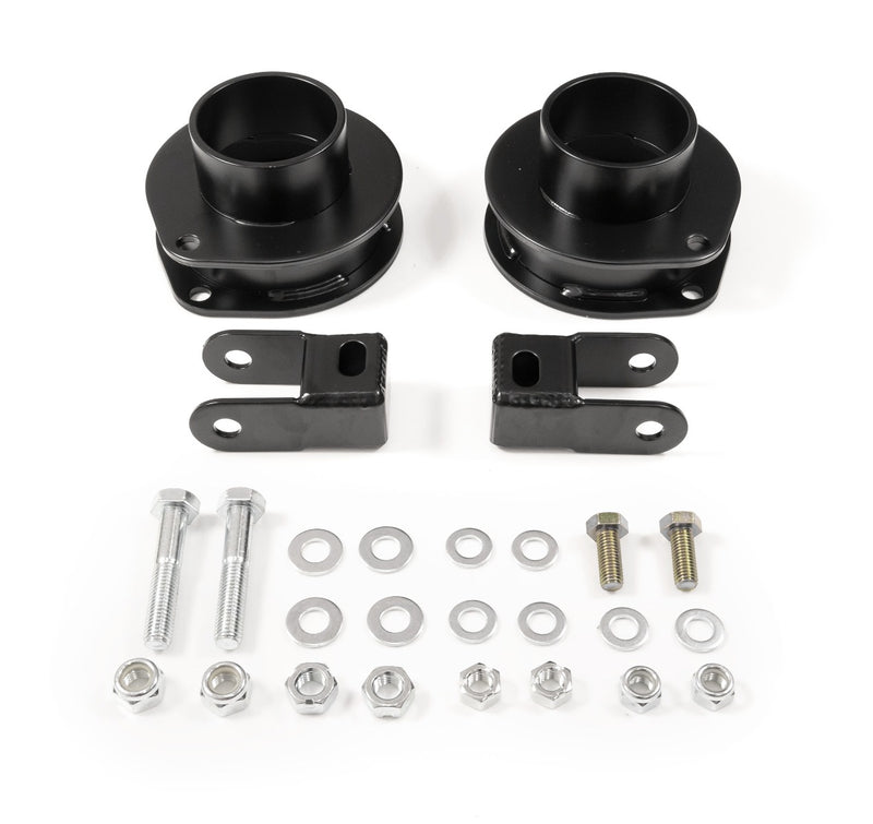ReadyLIFT Leveling Kit, full kit on a studio background: pair of black coil spacers with shock extension brackets, bolts, washers and nuts on white