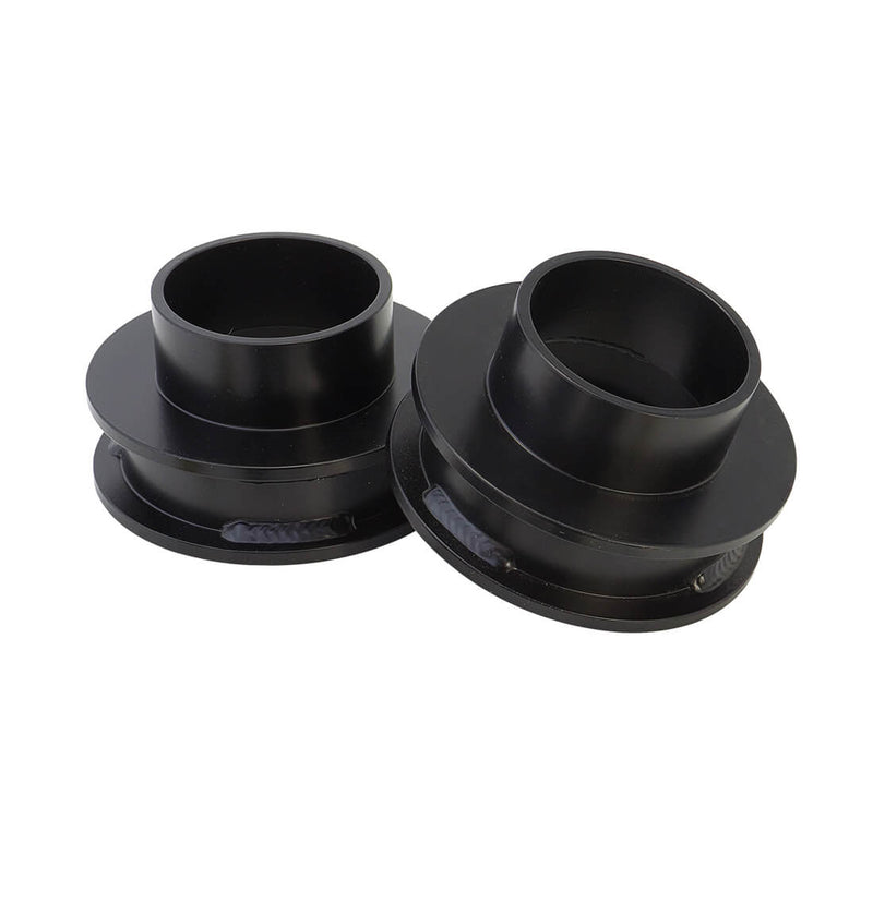 ReadyLIFT Leveling Kit, full kit on a studio background: pair of black coil spacers with top collars on white