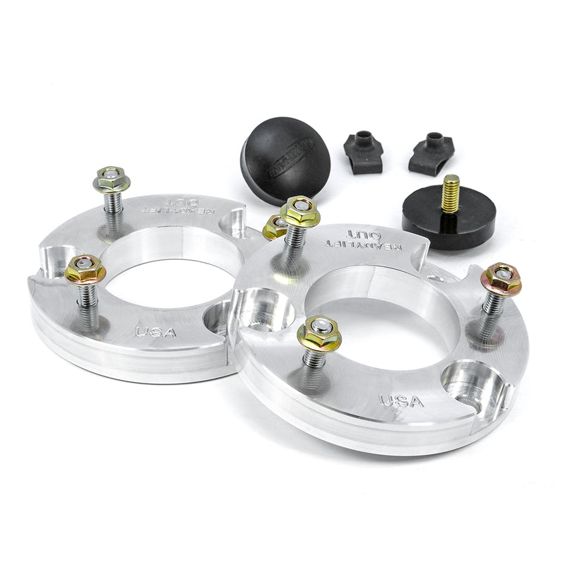 ReadyLIFT Leveling Kit, full kit on a studio background: two aluminum strut spacers with studs, bump stops and clips on white