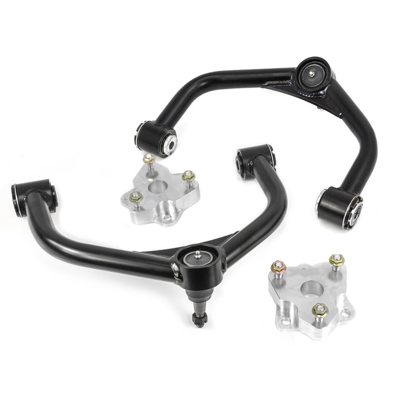 ReadyLIFT Leveling Kit, full kit on a studio background: two black tubular upper control arms and two aluminum strut spacers on white