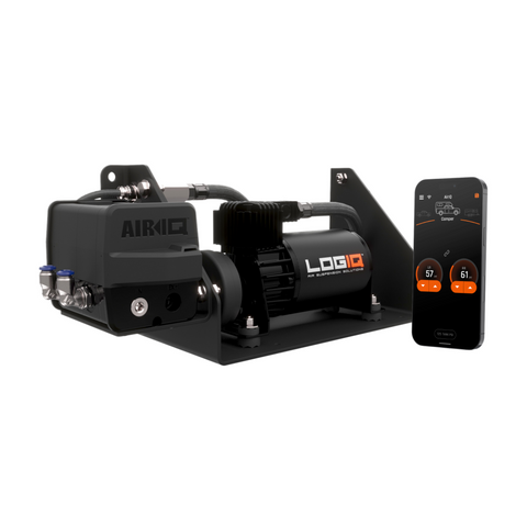ReadyLIFT LOGIQ AirIQ SD2 Air Management Package (2-Channel, SD Compressor), full kit on a studio background: AirIQ manifold and LOGIQ compressor on a black bracket beside a phone running the AirIQ app, on white