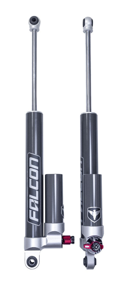ReadyLIFT Premium Falcon 3.3 Standalone Rear Pair, full kit on a studio background: two Falcon 3.3 shocks with piggyback reservoirs at the base and red adjusters on white