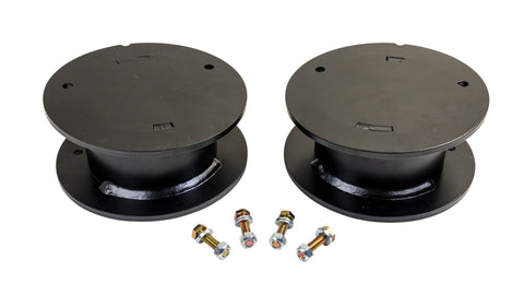 ReadyLIFT Spacer Kit, full kit on a studio background: two black round rear air spring spacers with four bolts on white