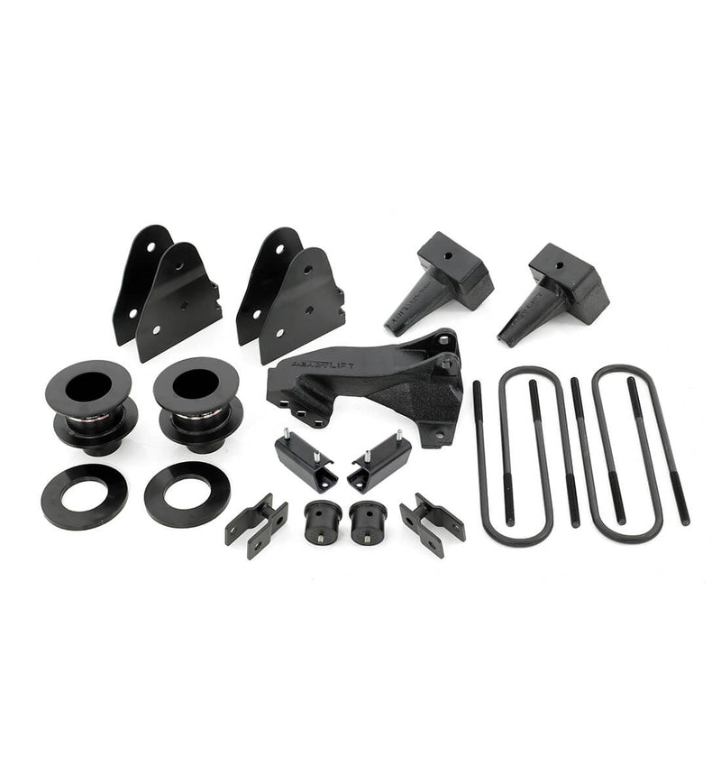 ReadyLIFT SST Lift Kit, full kit on a studio background: coil spacers, track bar bracket, shock brackets, tapered rear blocks and U-bolts on white
