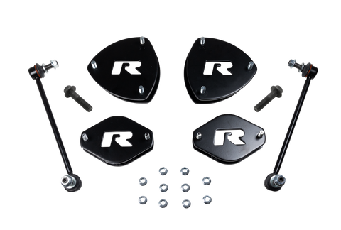 ReadyLIFT SST Lift Kit, full kit on a studio background: four black R strut spacers, two sway bar links, bolts and nuts on a black background