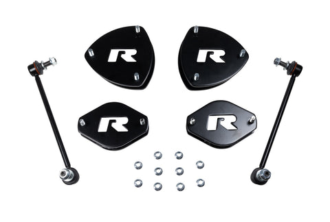 ReadyLIFT SST Lift Kit, full kit on a studio background: four black R strut spacers, two sway bar links and nuts on white