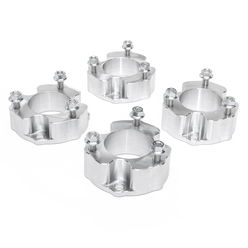 ReadyLIFT SST Lift Kit, full kit on a studio background: four machined aluminum strut spacers with studs and nuts on white