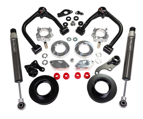 ReadyLIFT SST Lift Kit, full kit on a studio background: two black upper control arms, aluminum and black spacers, brackets, red bushings and two gray Falcon rear shocks on white