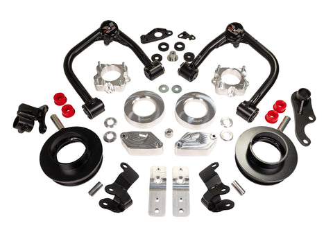 ReadyLIFT SST Lift Kit, full kit on a studio background: two black upper control arms, aluminum strut spacers, black coil spacers, brackets and red bushings on white