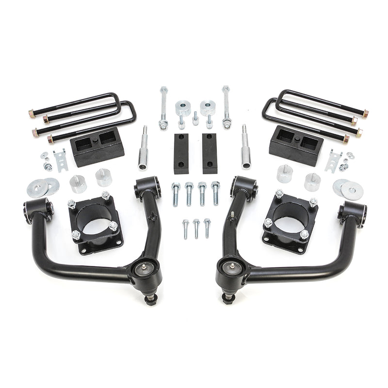 ReadyLIFT SST Lift Kit, full kit on a studio background: two black upper control arms, strut spacers, rear blocks, U-bolts and hardware on white