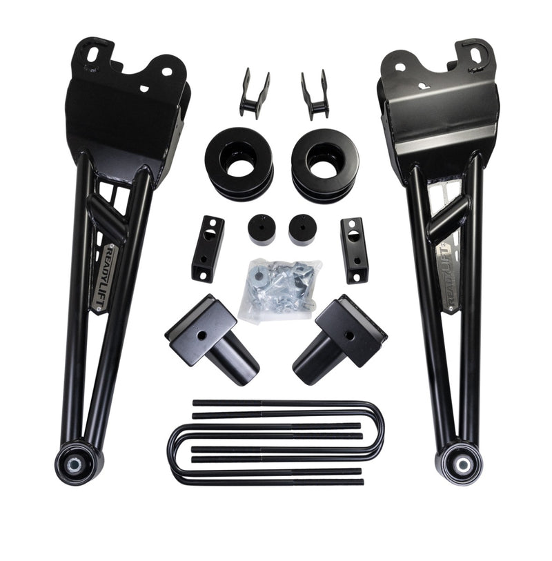 ReadyLIFT SST Lift Kit, full kit on a studio background: two long black ReadyLIFT radius arms, coil spacers, brackets, rear blocks, U-bolts and hardware on white