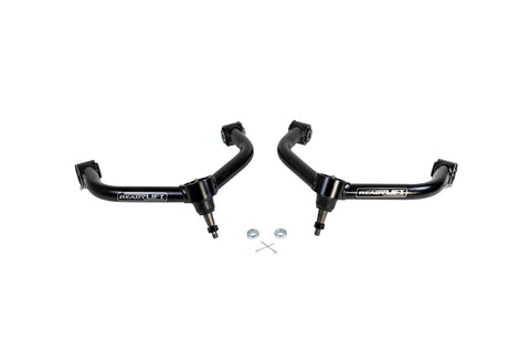 ReadyLIFT SST UCA, full kit on a studio background: A pair of black ReadyLIFT upper control arms with ball joints and small hardware on white