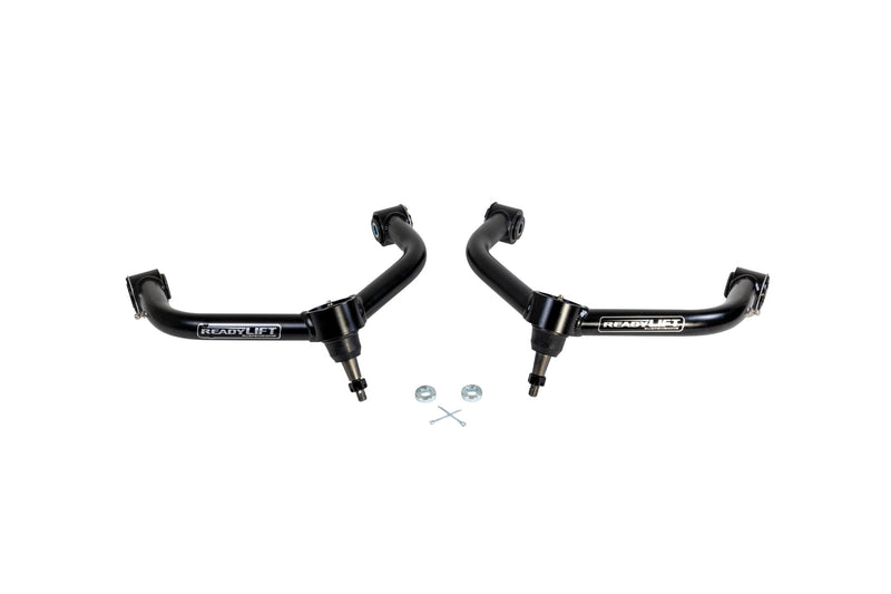 ReadyLIFT SST UCA, full kit on a studio background: A pair of black ReadyLIFT upper control arms with ball joints and small hardware on white