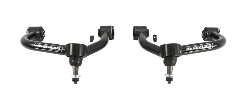 ReadyLIFT SST UCA, full kit on a studio background: A pair of black ReadyLIFT upper control arms with ball joints side by side on white