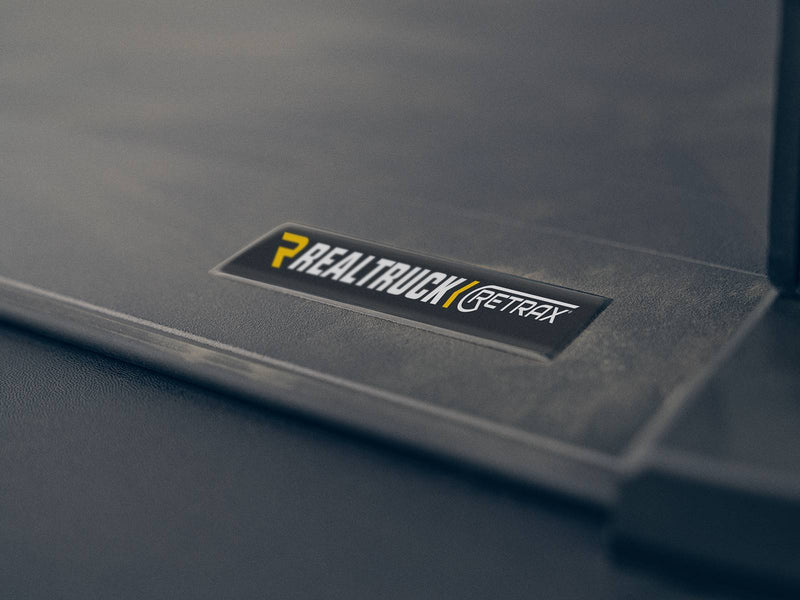 Retrax badge on the Retrax EQ cover surface