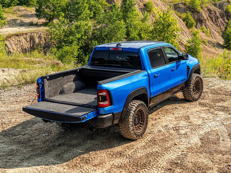 Retrax IX cover fully retracted into its canister for full bed access, tailgate down, outdoors