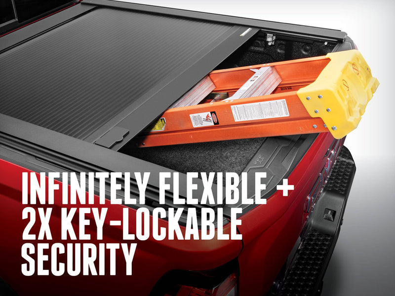 RetraxONE XR part-open over the tailgate end with a stepladder carried through the gap; overlay headline about flexibility and key-lockable security