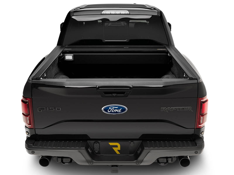 Retrax PowertraxPRO MX cover fully open, rear view showing the canister and its bed light