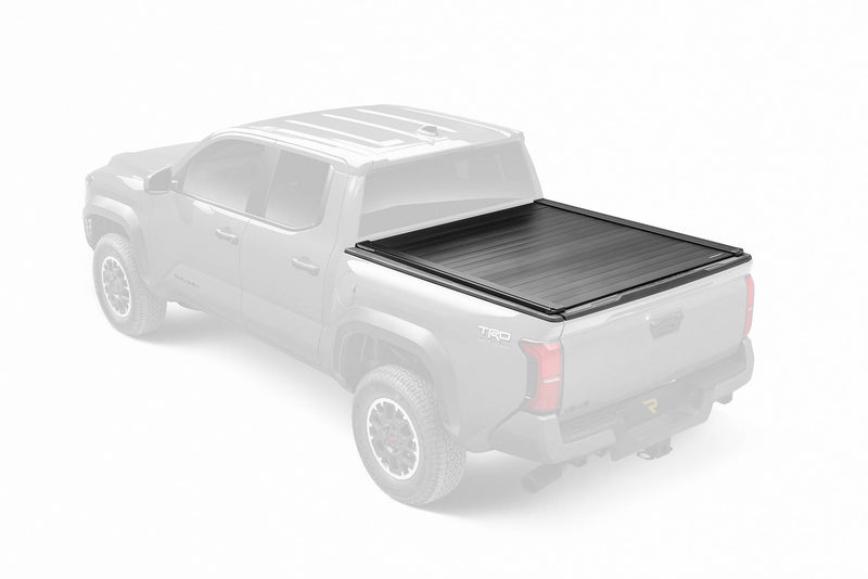 Retrax PowertraxPRO XR cover closed on a ghosted pickup, product in full color with the raised T-slot rails visible