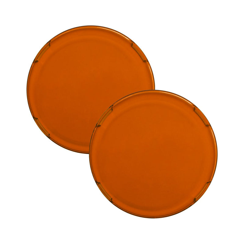 Rigid 360-Series 4" Cover Pair on a studio background: a pair of translucent amber round 4" light covers, overlapping on white