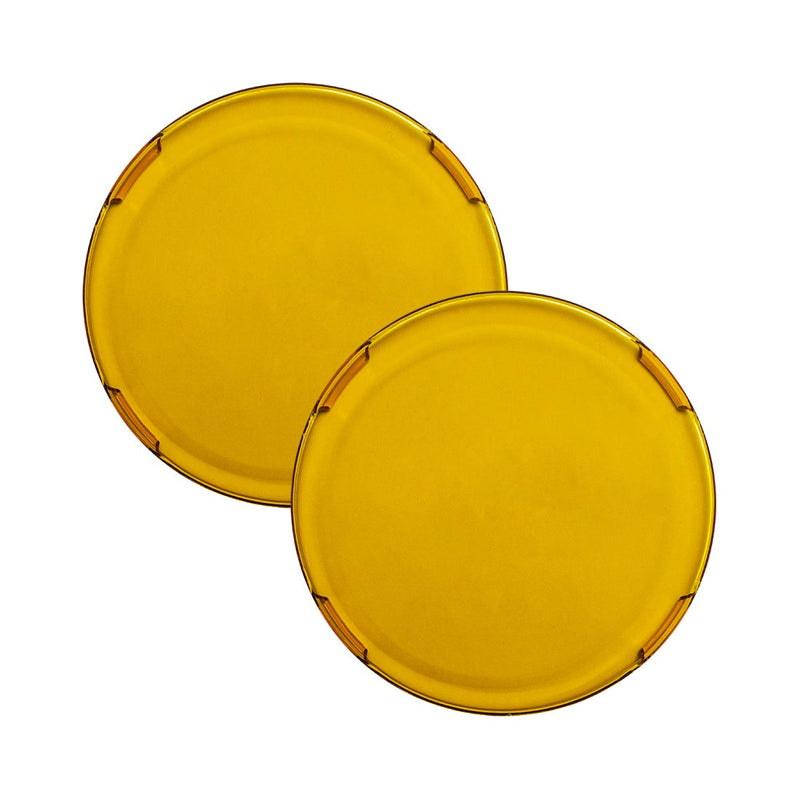 Rigid 360-Series 4" Cover Pair on a studio background: a pair of translucent yellow round 4" light covers, overlapping on white