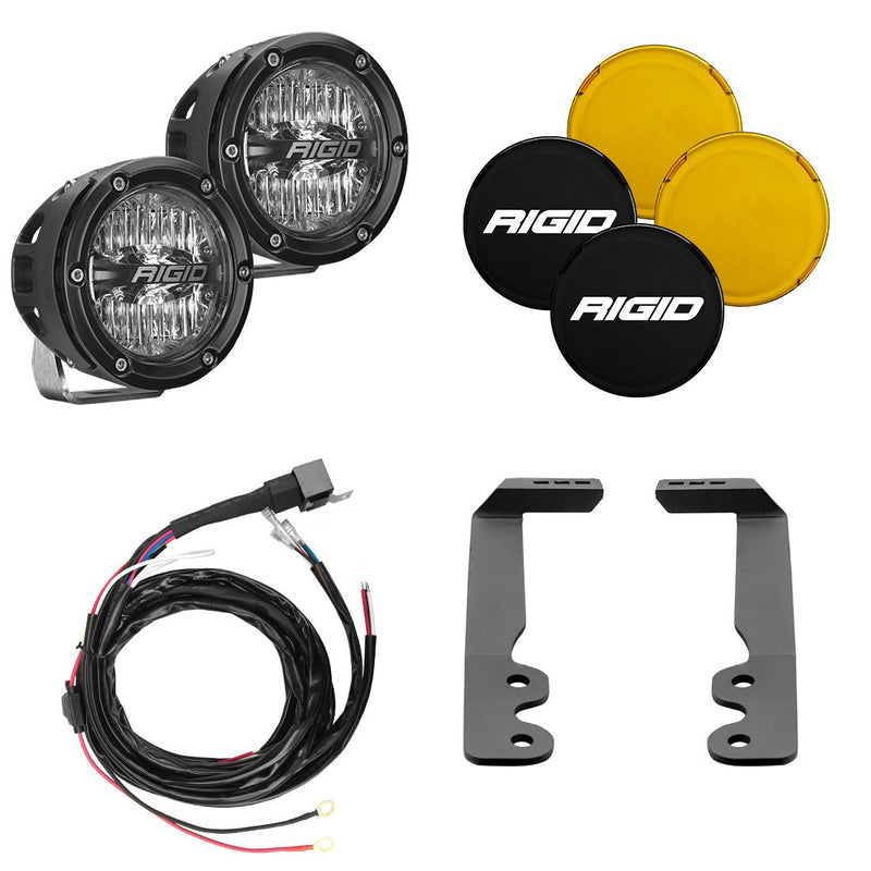 Rigid 360-Series 4" Drive A-Pillar Light Kit, kit contents laid out: pair of black 4" 360-Series pods with black and amber covers, a wiring harness and two A-pillar brackets on white