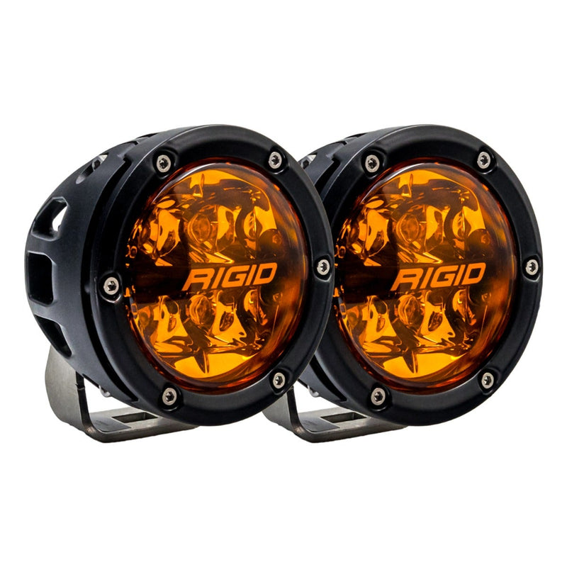 Rigid 360-Series PRO 4" Pair on a studio background: A pair of black 4" round LED lights with amber lenses on polished brackets against white