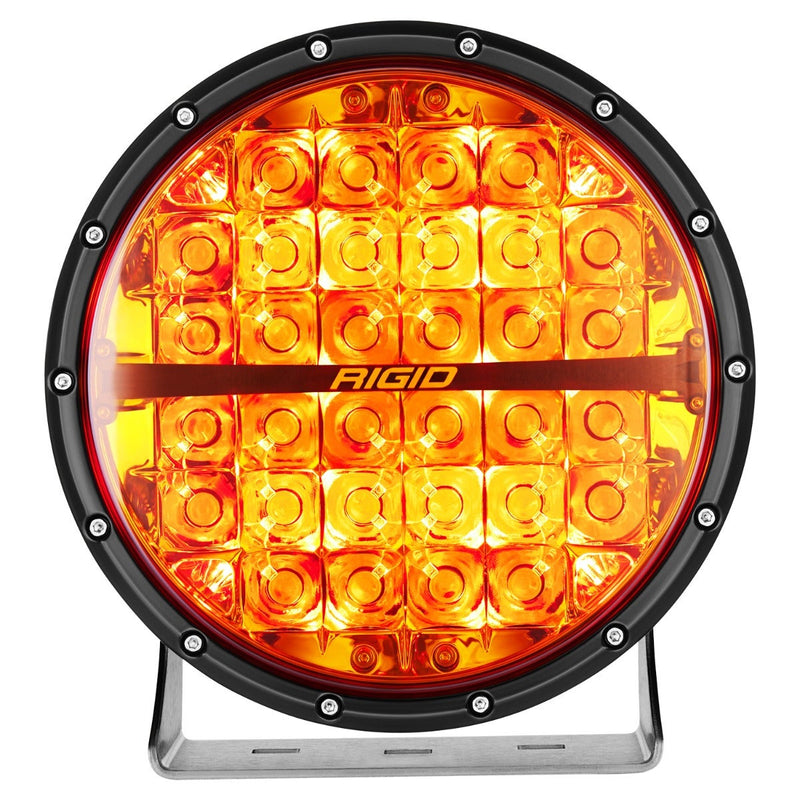 Rigid 360-Series PRO 9" on a studio background: front view of a black 9" round LED light with an amber lens on a brushed aluminum bracket