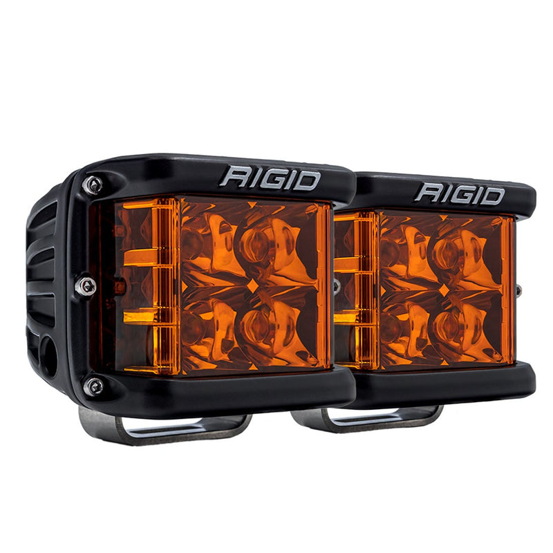 Rigid D-SS PRO Pods Pair on a studio background: A pair of black D-SS PRO side-shooter pods with amber lenses, angled, on a white background