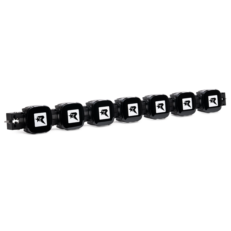 Rigid Phoenix 50" Connect Bar on a studio background: seven-pod connect bar fitted with black Rigid R covers against a black background