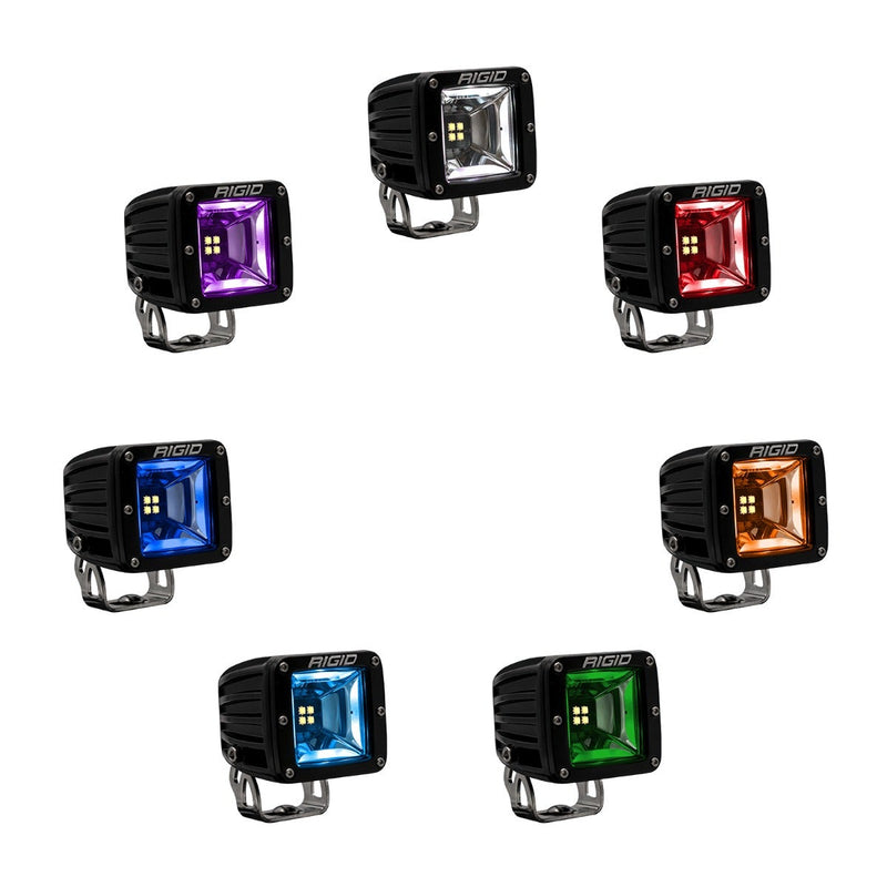 Rigid Radiance+ Scene RGBW Pods Pair on a studio background: seven Radiance+ scene surface-mount pods with brackets arranged in a circle, each lit in a different RGBW backlight color