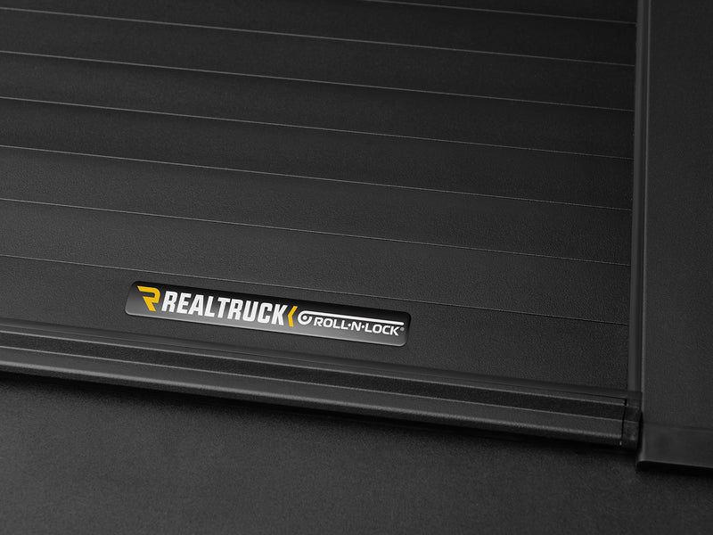 Roll-N-Lock A-Series aluminum slat surface with the manufacturer badge