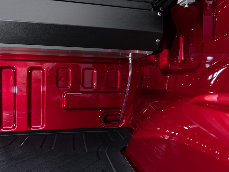 Roll-N-Lock A-Series canister end and side rail seen from inside the bed corner